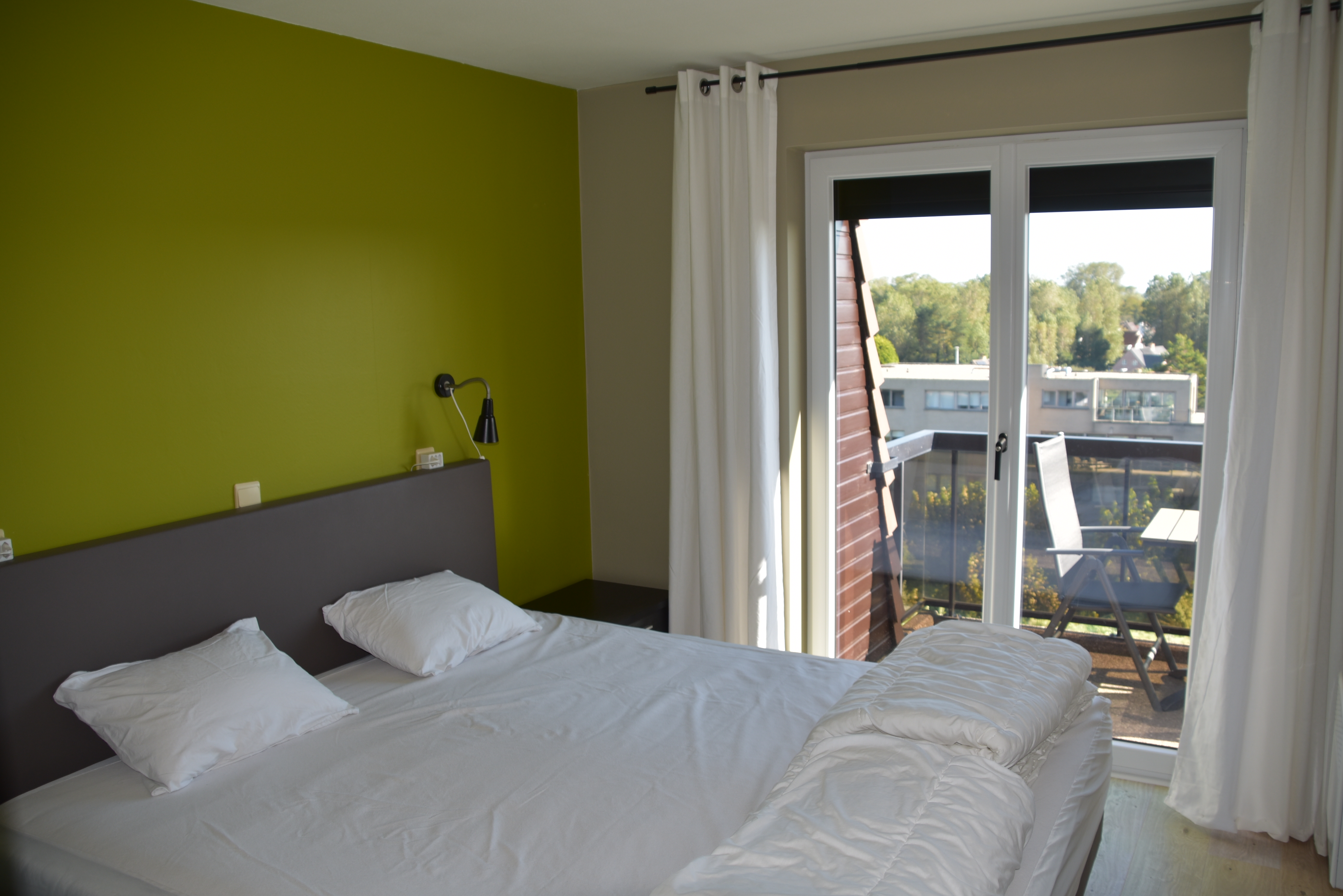 Masterbedroom met balkon